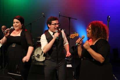 Singers performing live on stage