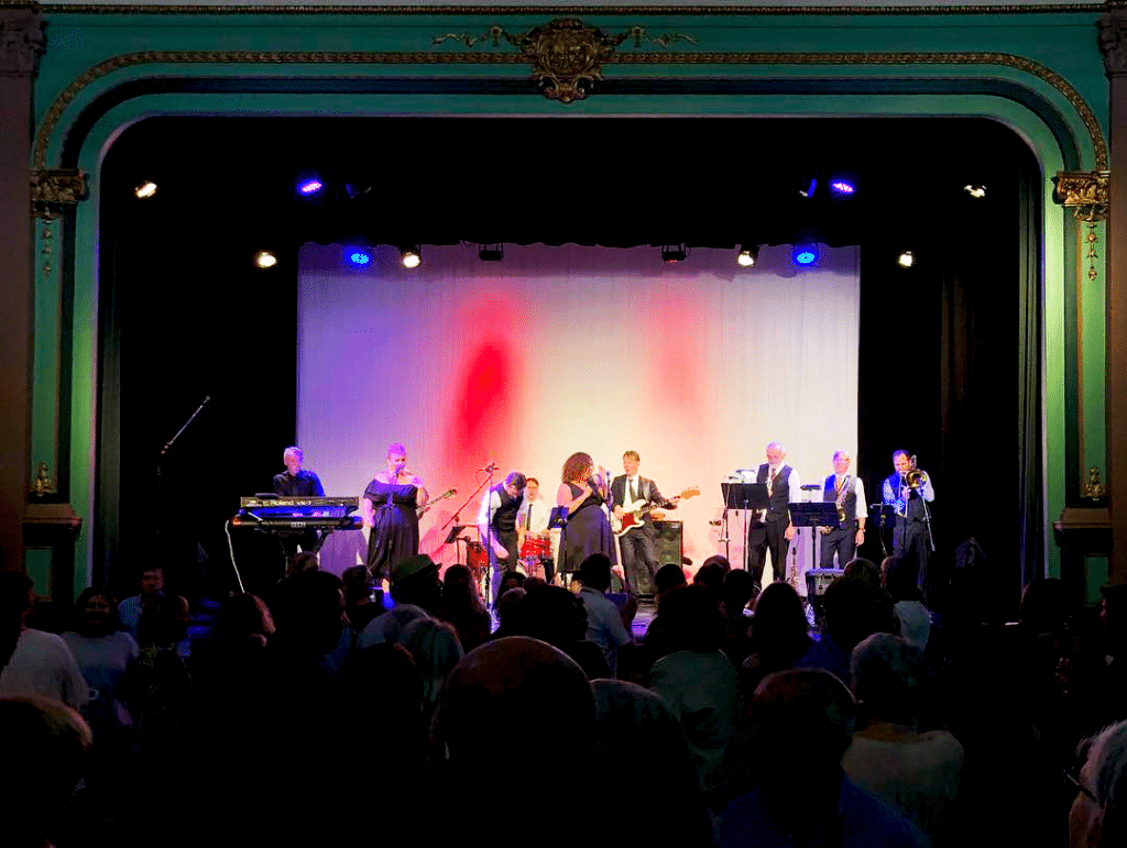 back lit image of the band on stage